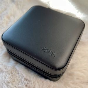 Compact travel sized jewelry case. Zipper closure. Brand new.